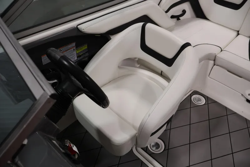 Slide: The Image of 2016 Yamaha Boats SX190 interior with white seating and steering wheel. - 18