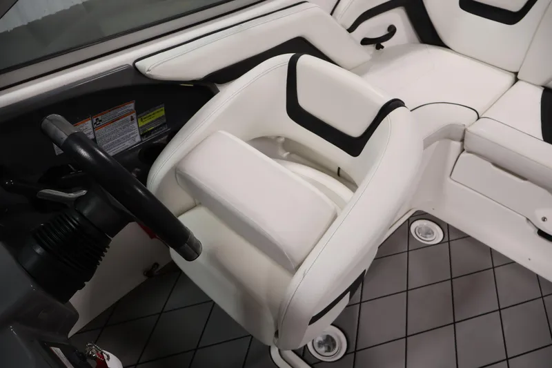 Slide: The Image of 2016 Yamaha Boats SX190 interior with white seating and steering wheel. - 19