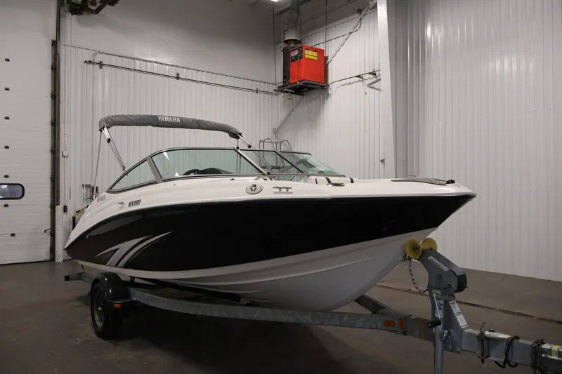 Slide: The Image of 2016 Yamaha Boats SX190 on trailer in indoor storage facility. - 2