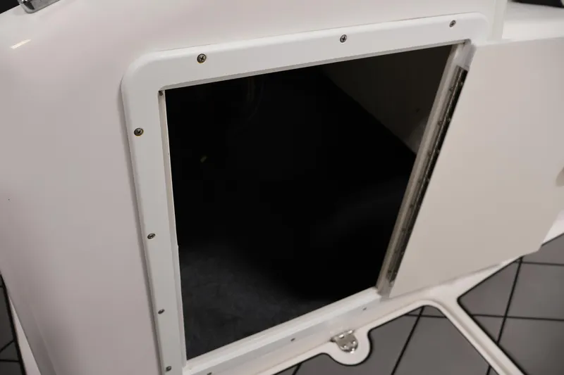 Slide: The Image of Open storage compartment on a 2016 Yamaha Boats SX190. - 21
