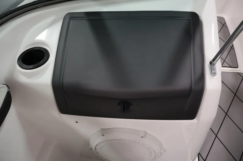 Slide: The Image of 2016 Yamaha Boats SX190 interior detail with speaker and storage compartment. - 22