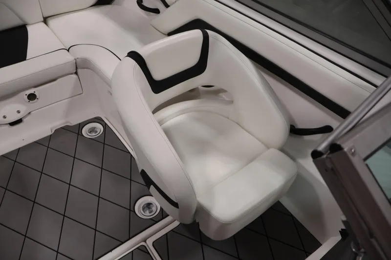 Slide: The Image of 2016 Yamaha Boats SX190 interior with white seating and gray flooring. - 24
