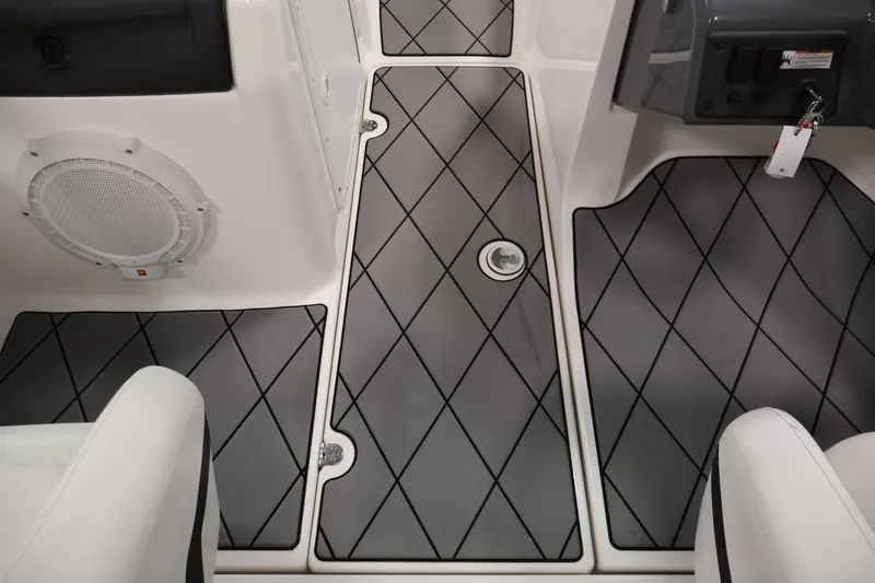 Slide: The Image of 2016 Yamaha Boats SX190 interior with diamond-patterned flooring and speaker. - 26