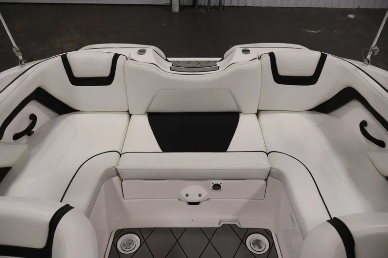 Slide: The Image of 2016 Yamaha Boats SX190 interior seating with white and black upholstery. - 28
