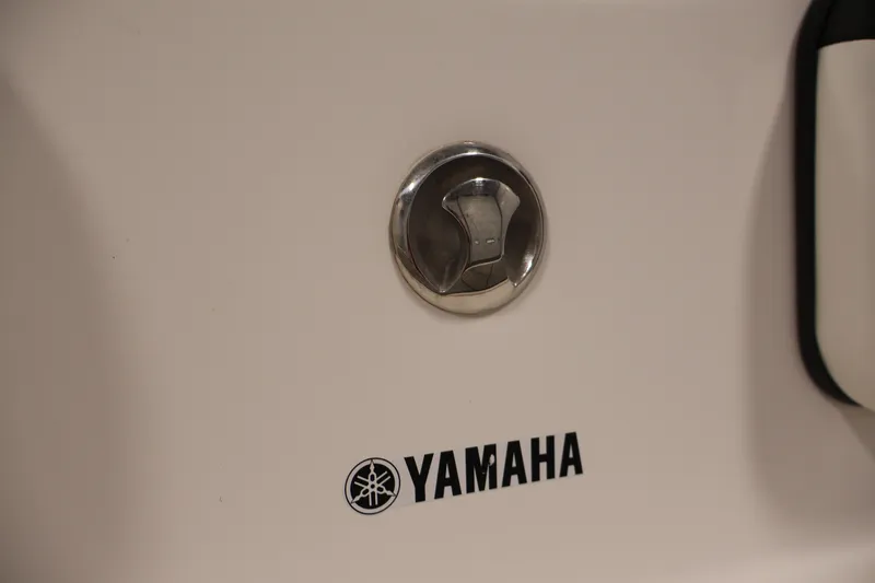 Slide: The Image of Close-up of 2016 Yamaha SX190 boat fuel cap and logo. - 32
