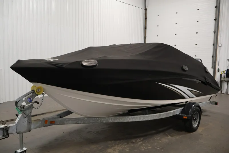 Slide: The Image of 2016 Yamaha Boats SX190 covered on trailer in indoor storage. - 38