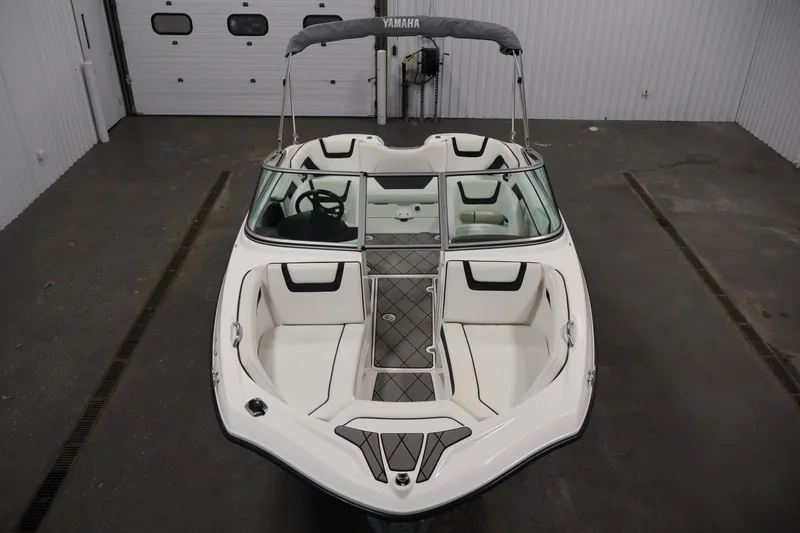 Slide: The Image of 2016 Yamaha Boats SX190 in a garage, showcasing sleek interior and design. - 8