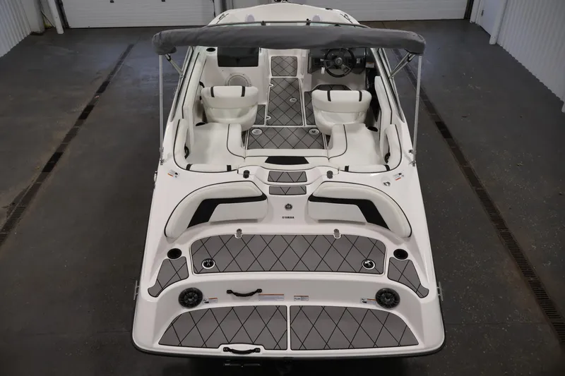 Slide: The Image of 2016 Yamaha Boats SX190 interior view, featuring sleek seating and modern design. - 9