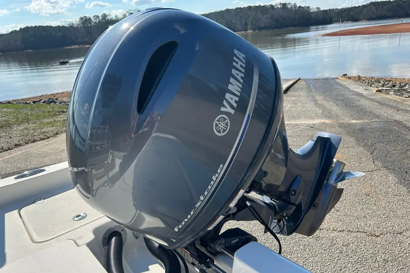 Slide: The Image of Yamaha outboard motor on 2021 Key West 188 Bay Reef boat by a lake. - 15
