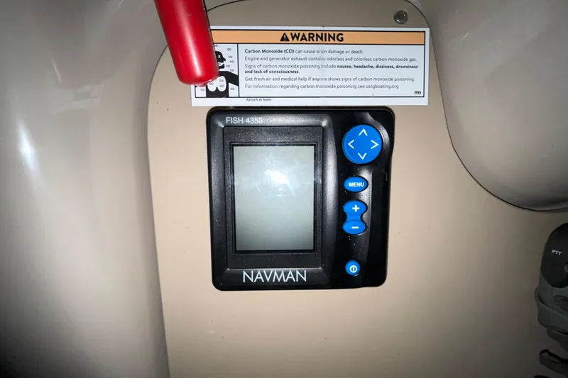 Slide: The Image of Navman Fish 4350 device on 2004 Sea Ray Sundancer 260 with carbon monoxide warning label. - 10