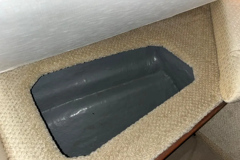 Slide: The Image of Storage compartment in 2004 Sea Ray Sundancer 260 boat interior. - 21