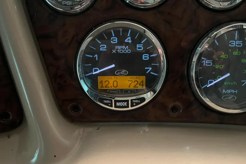 Slide: The Image of Dashboard of 2004 Sea Ray Sundancer 260 showing RPM, volts, and engine hours. - 9
