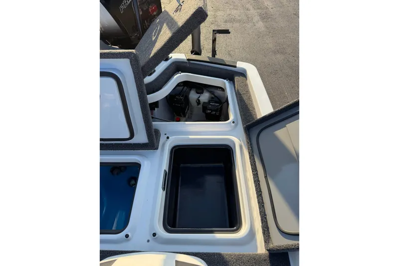 Slide: The Image of 2024 Ikon Boats 21 model showing open storage compartments and engine area. - 19