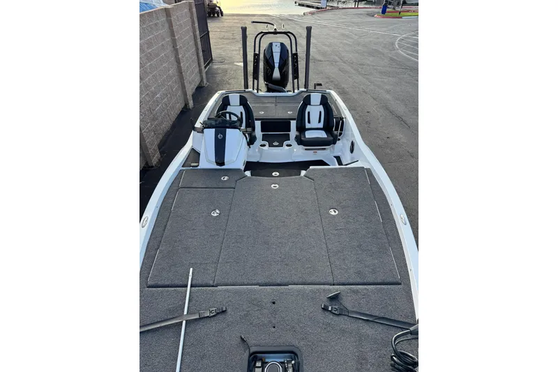 Slide: The Image of 2024 Ikon Boats 21 model with spacious deck and dual seating. - 4