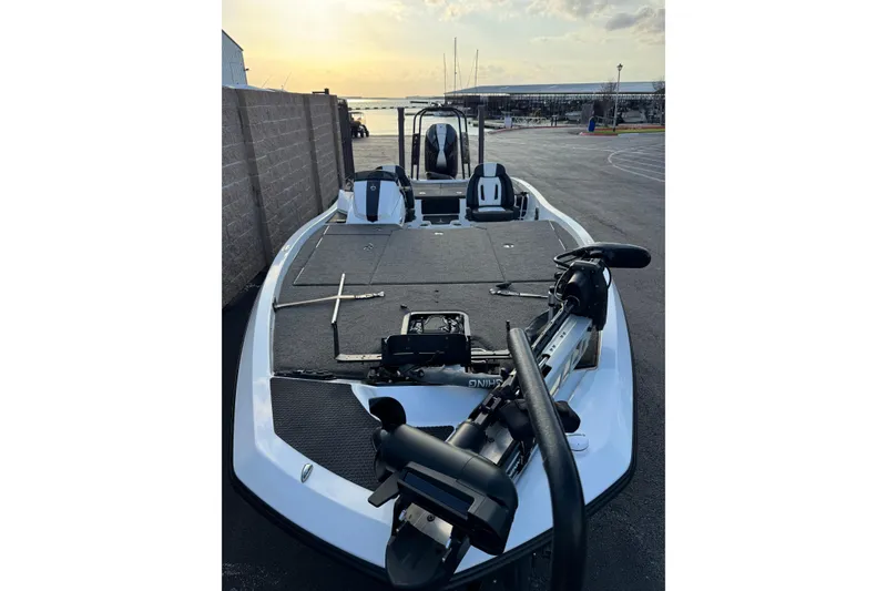 Slide: The Image of 2024 Ikon Boats 21 model, sleek design, docked at sunset. - 5