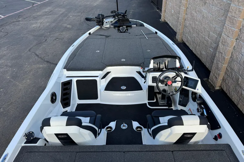 Slide: The Image of 2024 Ikon Boats 21 model, featuring a sleek interior with dual seating and modern controls. - 8