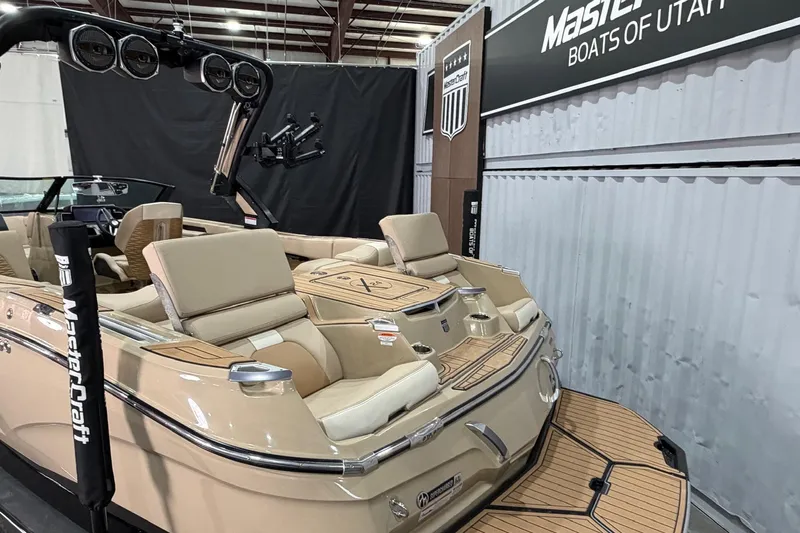 Slide: The Image of 2025 MasterCraft X24 boat interior at Utah showroom, featuring luxurious seating and modern design. - 18