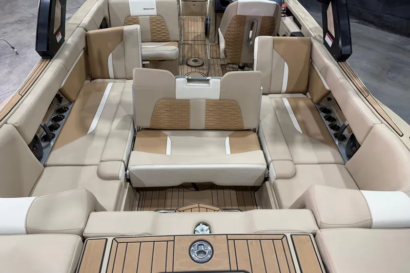 Slide: The Image of Luxurious interior of 2025 MasterCraft X24 boat with beige and tan seating. - 19