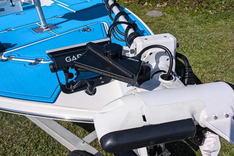 Slide: The Image of 2023 ShearWater X22 Hybrid boat with Garmin equipment on blue deck. - 19