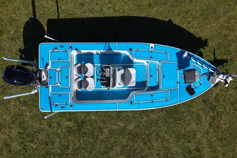 Slide: The Image of Overhead view of 2023 ShearWater X22 Hybrid boat on grass. - 23