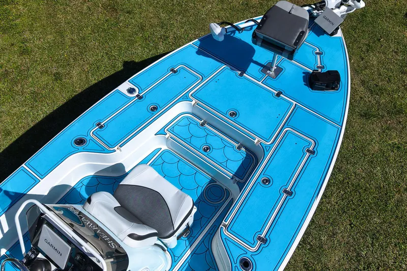 Slide: The Image of 2023 ShearWater X22 Hybrid boat with blue deck, featuring Garmin equipment. - 24