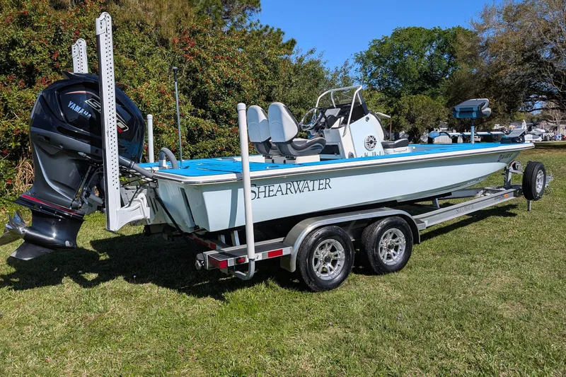 Slide: The Image of 2023 ShearWater X22 Hybrid boat on trailer with Yamaha outboard motor. - 5