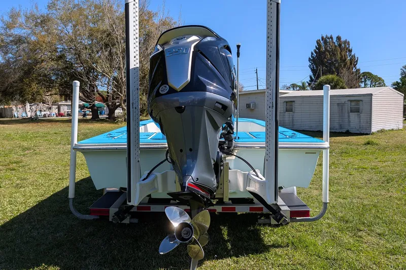 Slide: The Image of 2023 ShearWater X22 Hybrid boat with powerful outboard motor on trailer. - 9