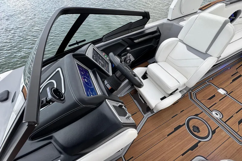 Slide: The Image of 2023 Supra SE 550 boat interior with modern dashboard and luxurious seating. - 14