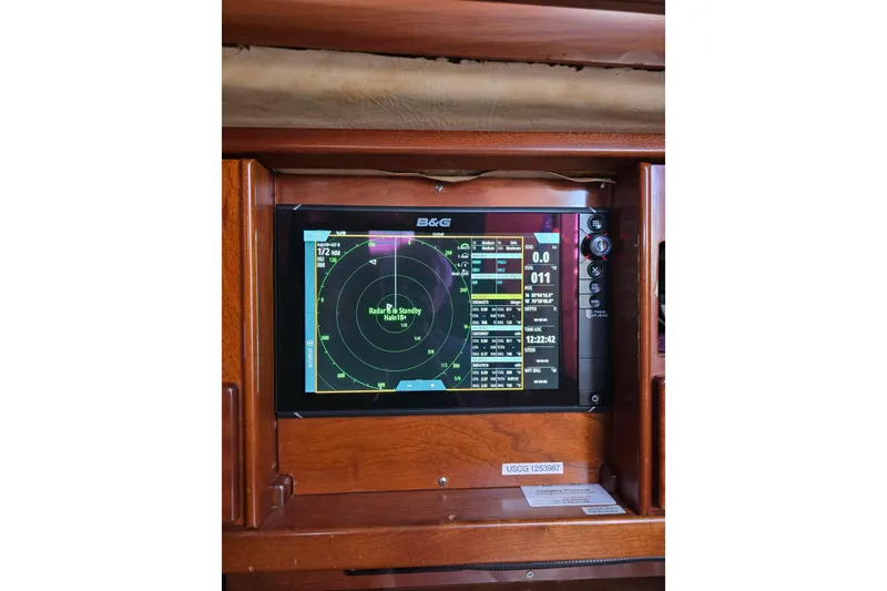 Slide: The Image of Radar display on 1988 Amel Sharki yacht, showing navigation data and settings. - 18