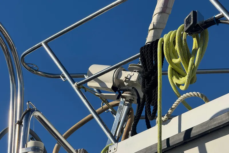 Slide: The Image of Close-up of 1988 Amel Sharki yacht rigging and ropes against clear blue sky. - 8