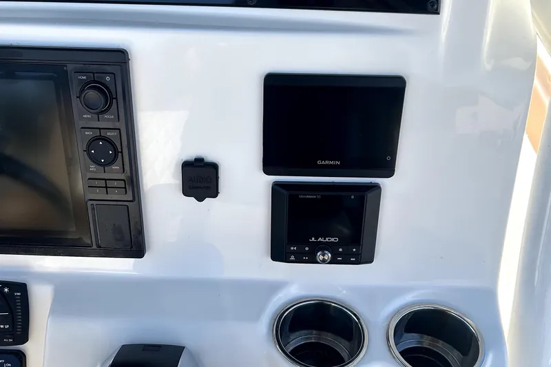 Slide: The Image of Dashboard of 2023 Pioneer 222 Islander with Garmin and JL Audio systems. - 12