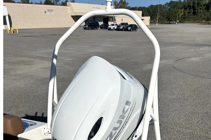 Slide: The Image of 2023 Pioneer 222 Islander boat with Suzuki outboard motor in parking lot. - 13