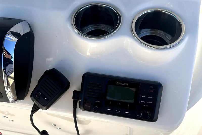 Slide: The Image of 2023 Pioneer 222 Islander boat console with Garmin radio and dual cup holders. - 15