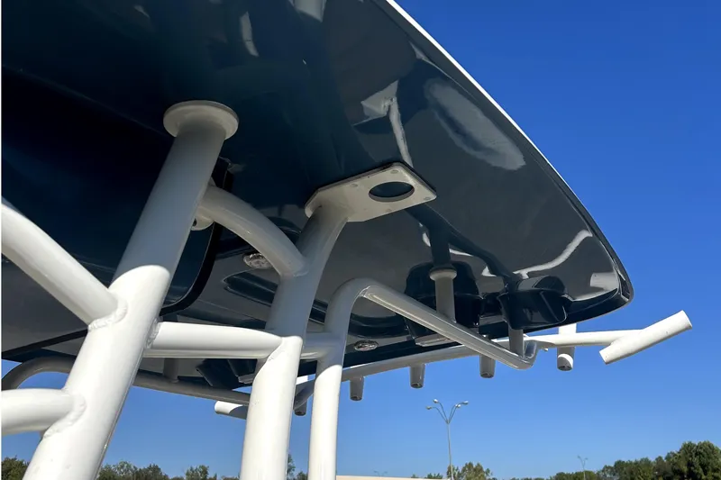 Slide: The Image of 2023 Pioneer 222 Islander boat T-top structure against clear blue sky. - 17