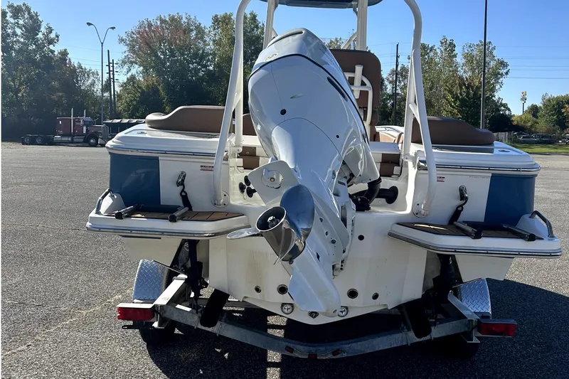 Slide: The Image of 2023 Pioneer 222 Islander boat on trailer, rear view with outboard motor. - 6