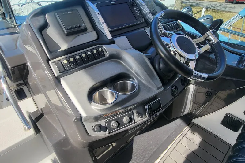Slide: The Image of Cockpit of 2016 Monterey 335 Sport Yacht with steering wheel and control panel. - 14