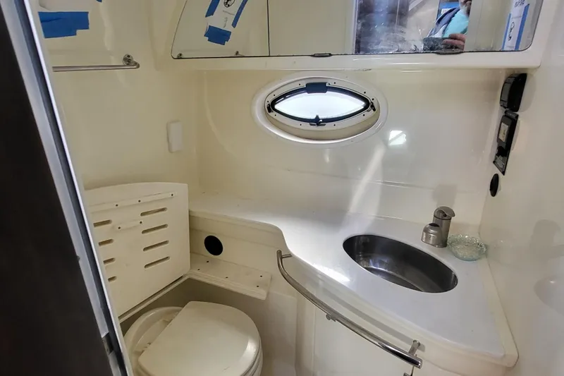 Slide: The Image of Bathroom interior of 2016 Monterey 335 Sport Yacht with sink and porthole window. - 17