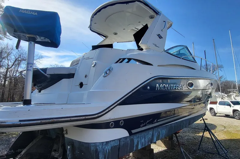 Slide: The Image of 2016 Monterey 335 Sport Yacht on dry dock, showcasing sleek design and modern features. - 5