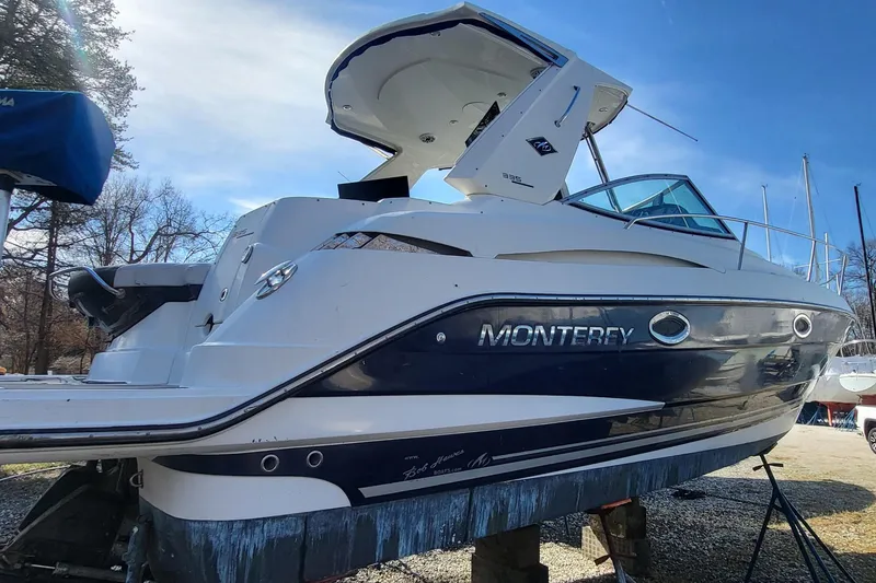 Slide: The Image of 2016 Monterey 335 Sport Yacht on dry dock, showcasing sleek design and modern features. - 6