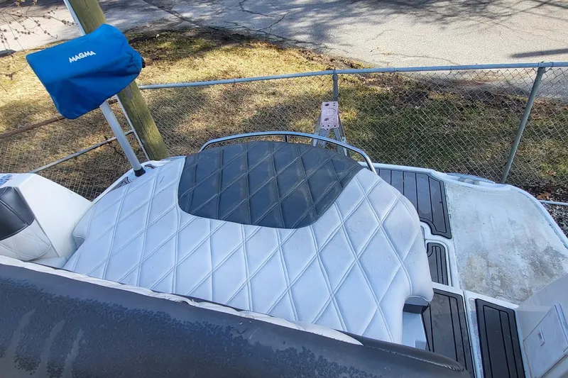 Slide: The Image of 2016 Monterey 335 Sport Yacht deck with cushioned seating and Magma grill cover. - 9