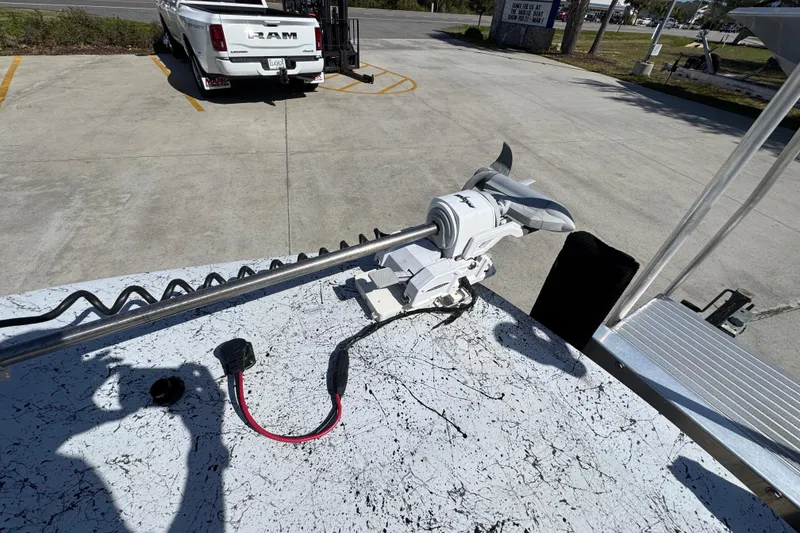 Slide: The Image of Trolling motor on Dek Kat 27 Trilogy boat, 2023 model, in parking lot. - 19