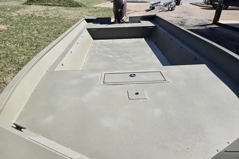 Slide: The Image of 2025 Tracker Grizzly 2072 Utility boat with spacious deck, parked outdoors. - 10