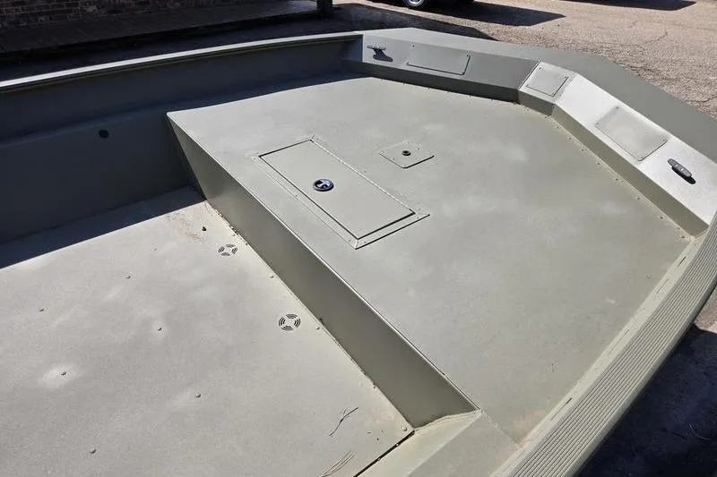 Slide: The Image of 2025 Tracker Grizzly 2072 Utility boat interior with storage compartments. - 11