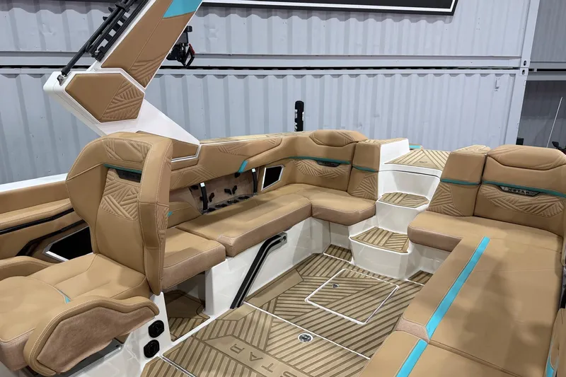 Slide: The Image of 2025 MasterCraft XStar 23 interior with tan upholstery and modern design. - 5