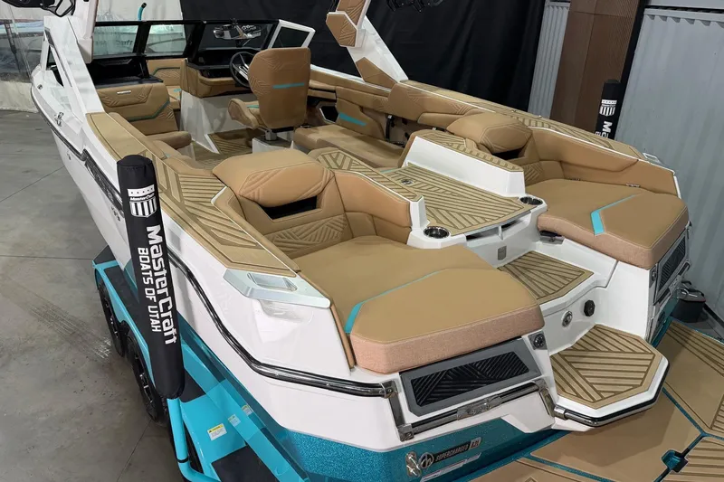 Slide: The Image of 2025 MasterCraft XStar 23 boat with luxurious tan seating and modern design. - 6