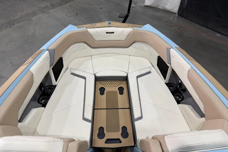 Slide: The Image of 2025 MasterCraft XStar 25 boat interior with luxurious seating and modern design. - 12