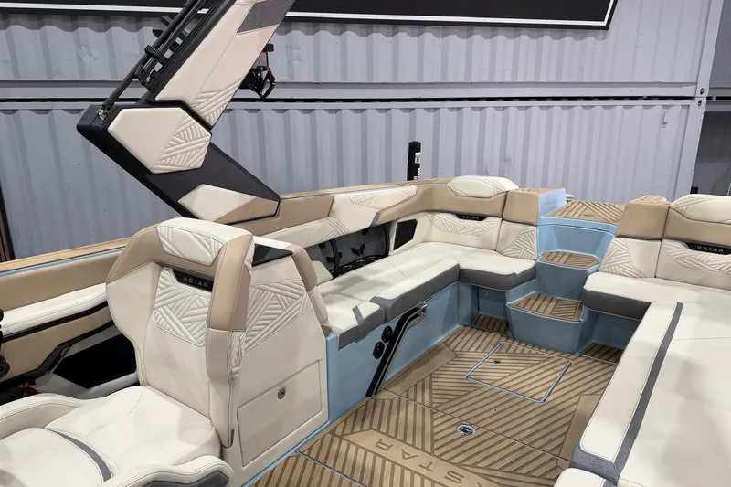 Slide: The Image of 2025 MasterCraft XStar 25 boat interior with luxurious seating and modern design. - 5