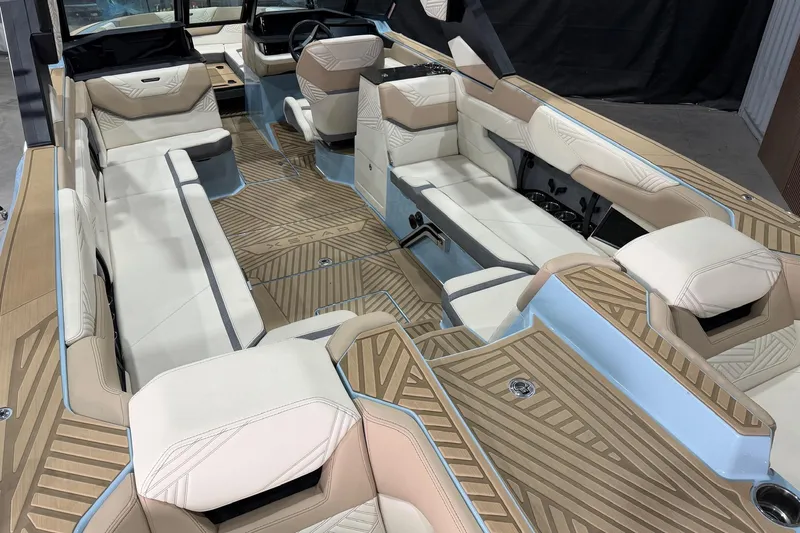 Slide: The Image of 2025 MasterCraft XStar 25 interior with luxurious seating and modern design. - 7