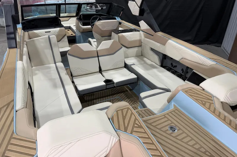 Slide: The Image of Luxurious interior of 2025 MasterCraft XStar 25 boat with beige and white seating. - 8