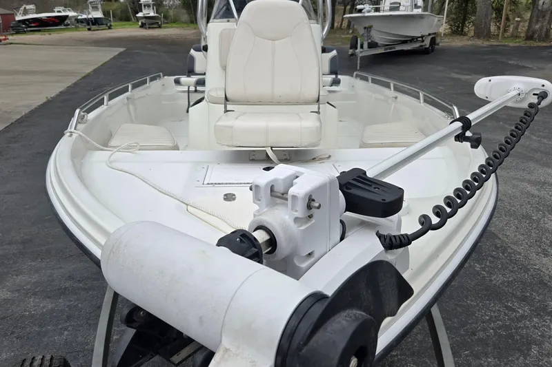 Slide: The Image of 2001 VIP 1880 BAY STEALTH boat with trolling motor and seating, parked on a trailer. - 10